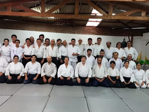 a group of people in white shirts