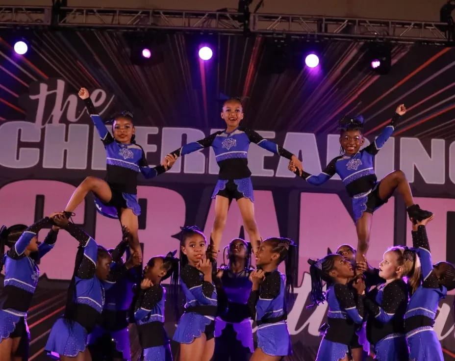 a group of cheerleaders on a stage