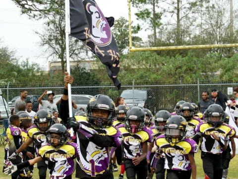 a group of kids in football gear