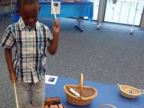 a boy holding a stick