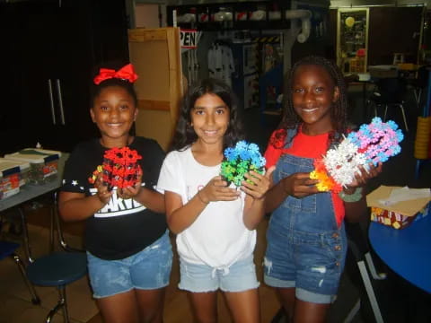 a group of girls holding candy