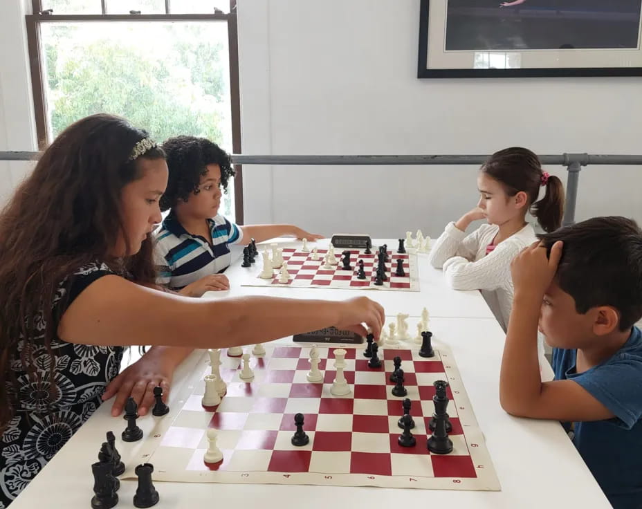 a group of people playing chess
