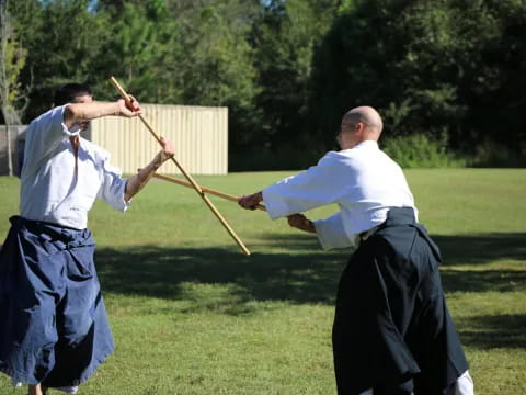 a couple of men in a field