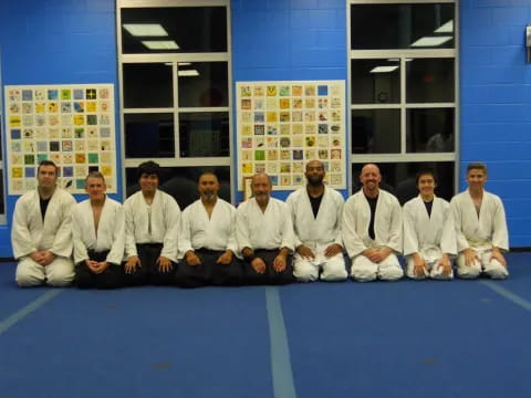 a group of men in white shirts