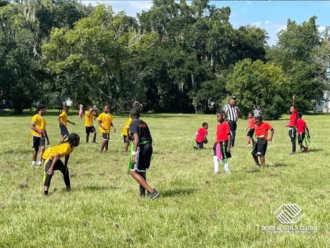 a group of kids playing football