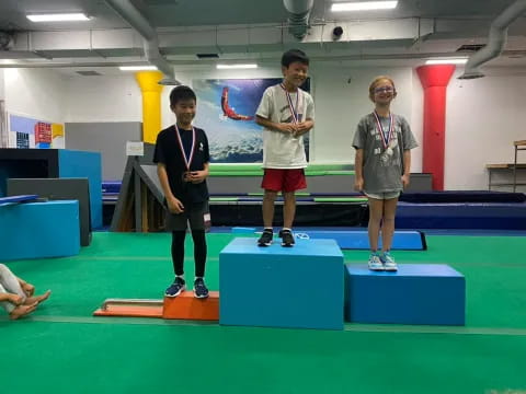 a group of boys wearing medals
