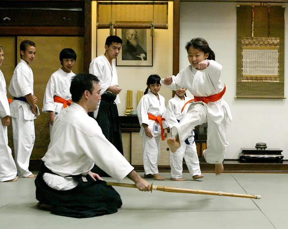 a group of people in karate uniforms