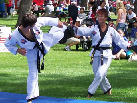 a couple of people in karate uniforms