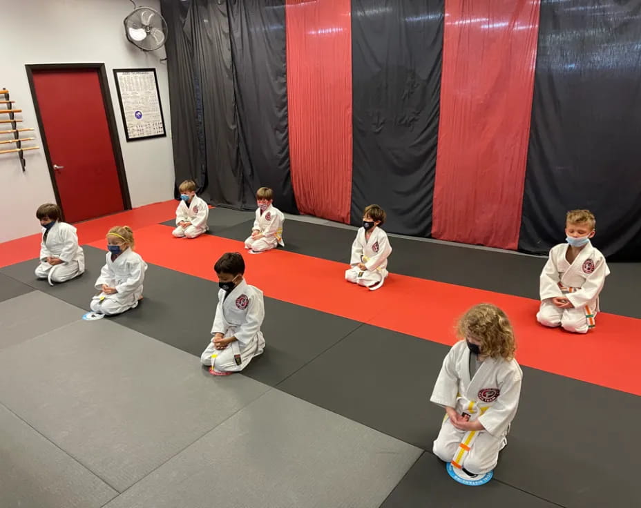 a group of children sitting on the floor