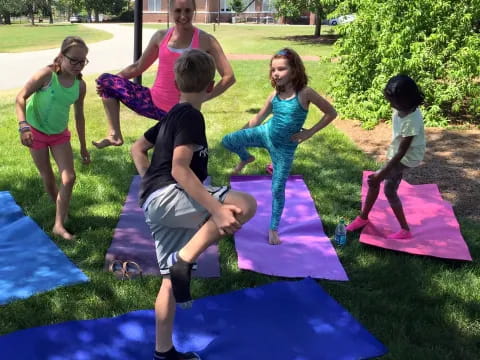 a group of people on mats