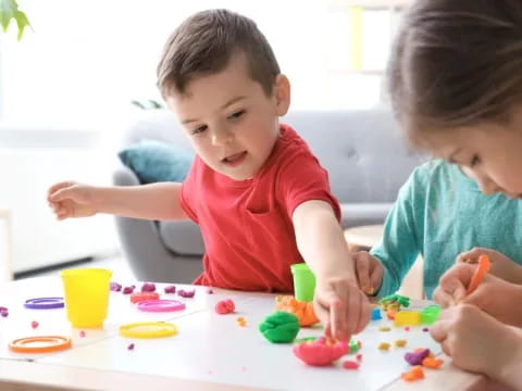 a couple of kids playing with toys