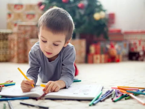 a child coloring on a paper
