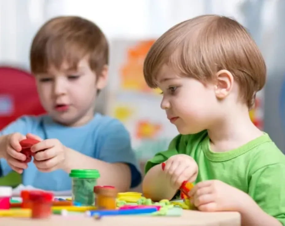 a couple of boys playing with toys