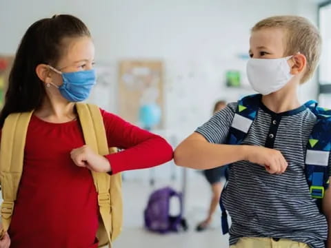 a person and a child wearing masks