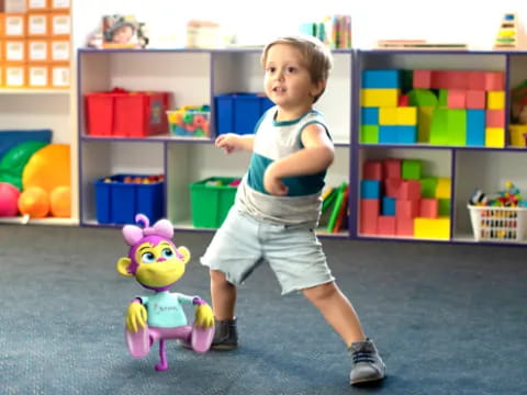 a child standing on a toy