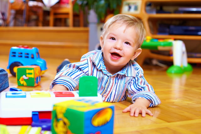 a baby playing with toys