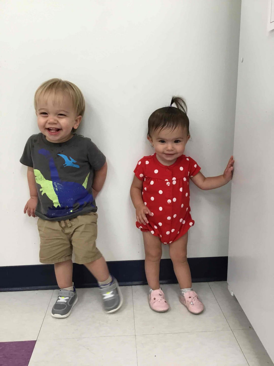 a couple of children posing for the camera