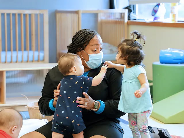 a woman holding a child