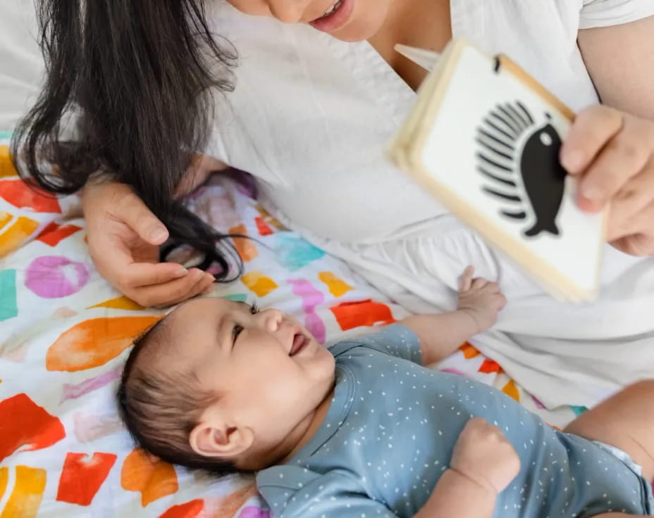 a woman holding a baby