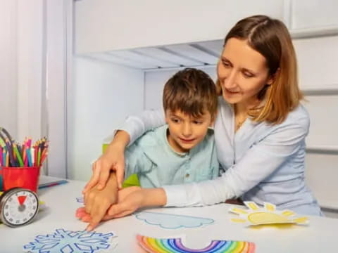 a person and a child painting