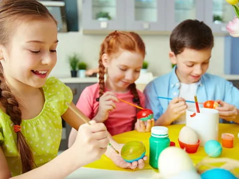 a group of children painting