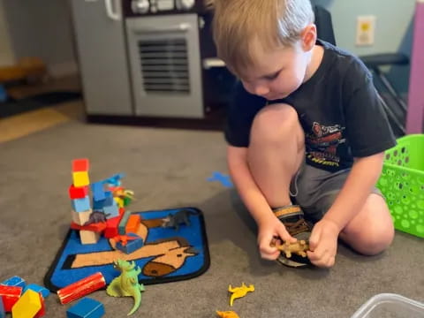 a boy playing with toys