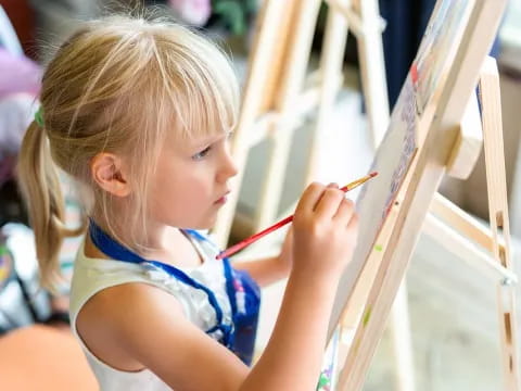 a young girl painting