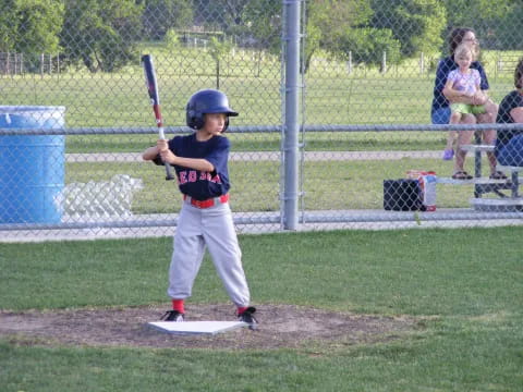 a young boy playing baseball