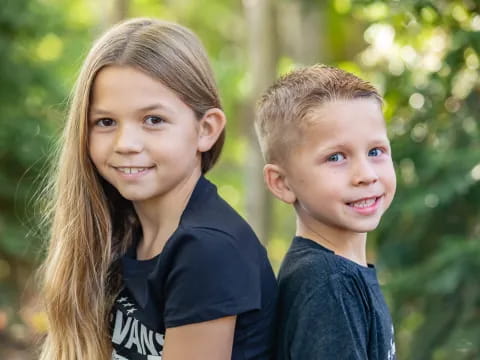 a couple of children smiling