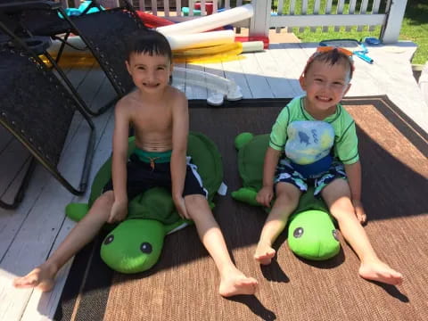 two kids sitting on a bench