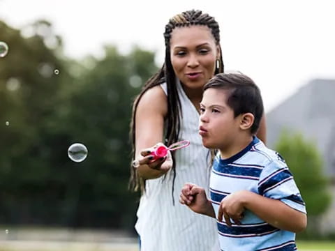 a person holding a child