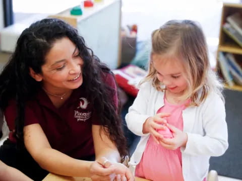 a person holding a little girl