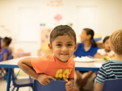 a boy sitting at a desk