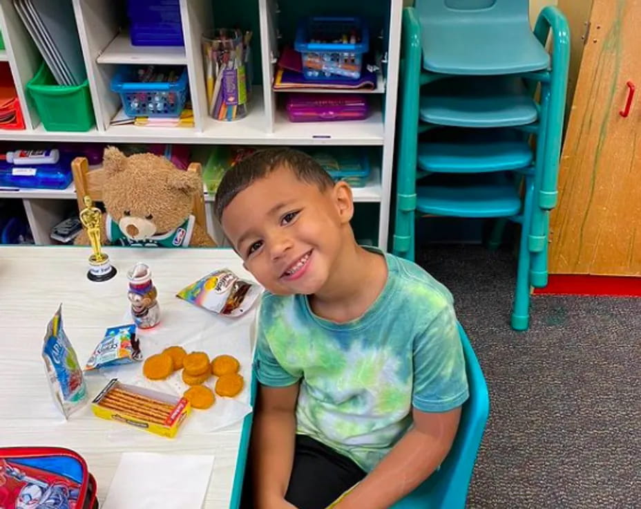 a boy sitting at a table