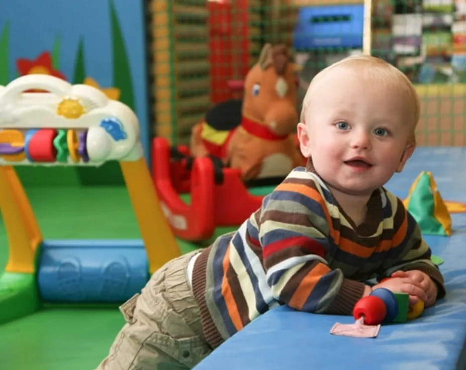 a baby sitting on a chair