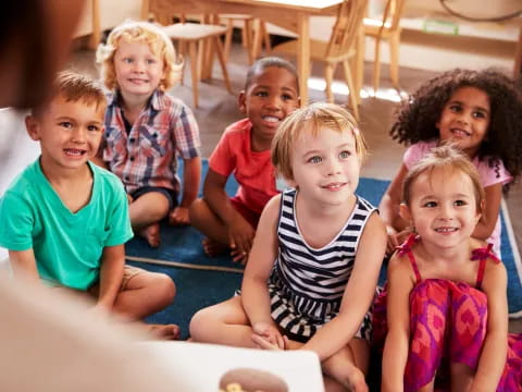 a group of children sitting on the floor