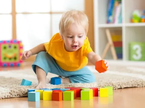 a baby playing with toys
