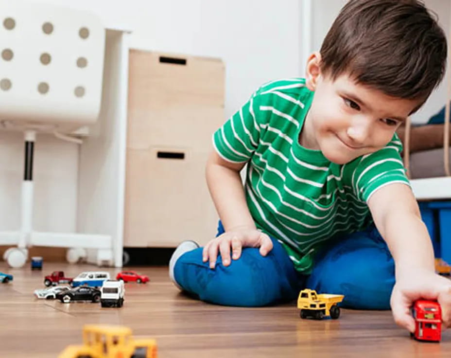 a boy playing with toys