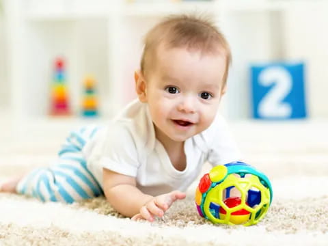 a baby crawling on the floor