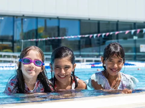 a group of girls in a pool