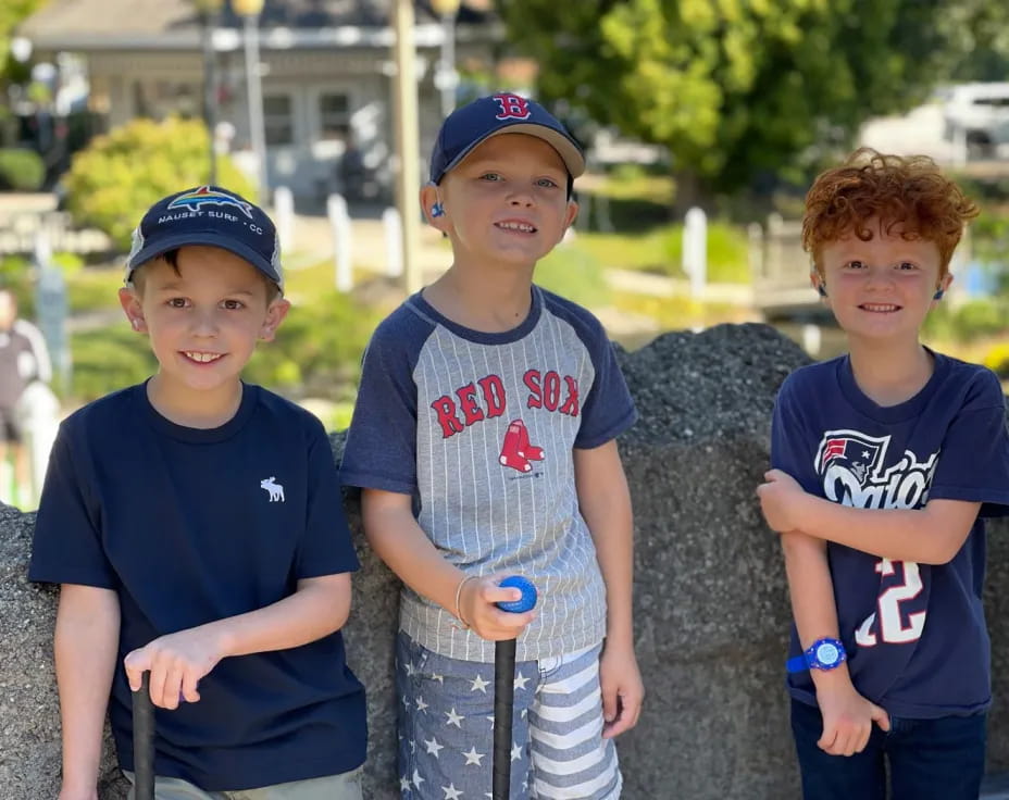 a group of boys posing for a picture