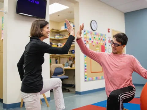 a man and a woman in a classroom