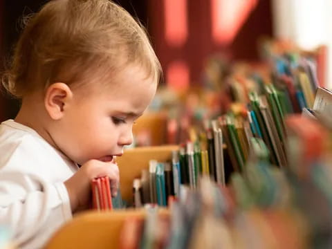 a young boy brushes his teeth