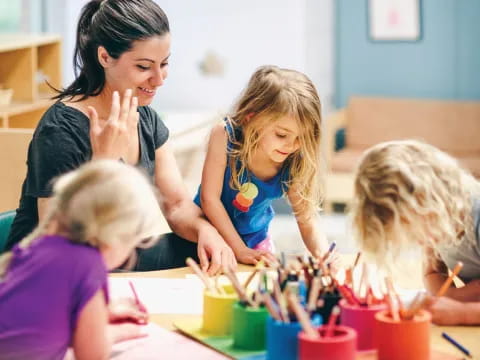 a group of children painting