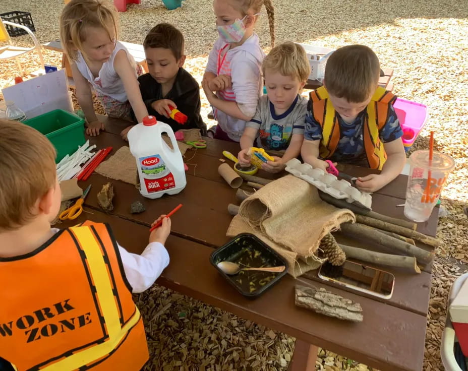 a group of children painting