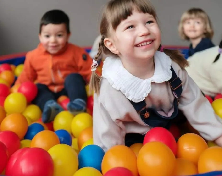 a group of children in a ball pit