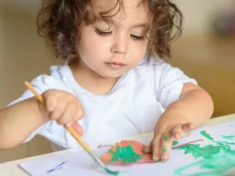 a young girl painting