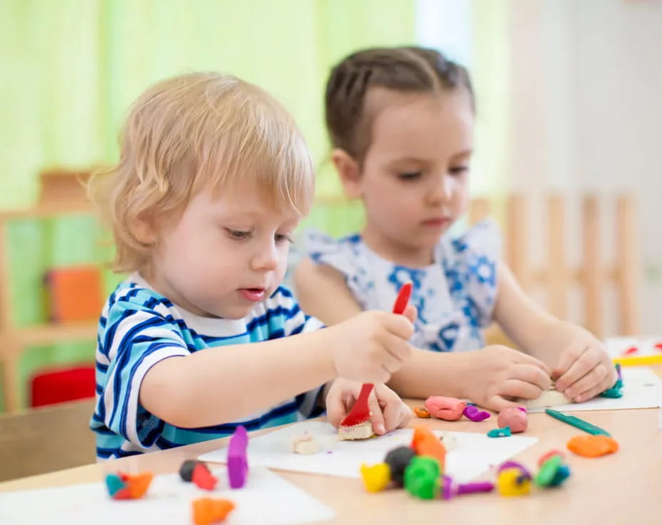 a couple of kids playing with toys