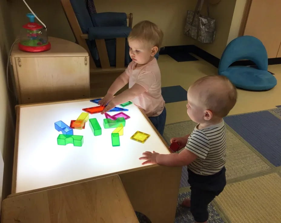 two boys playing with toys