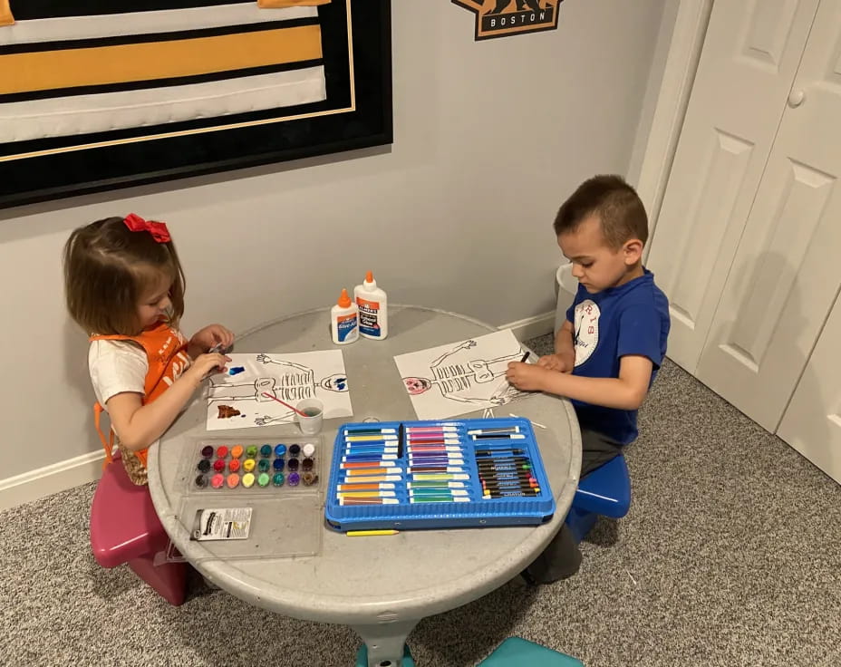 a couple of kids playing with a toy